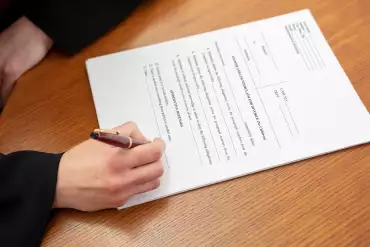 Couple signing domestic partnership document